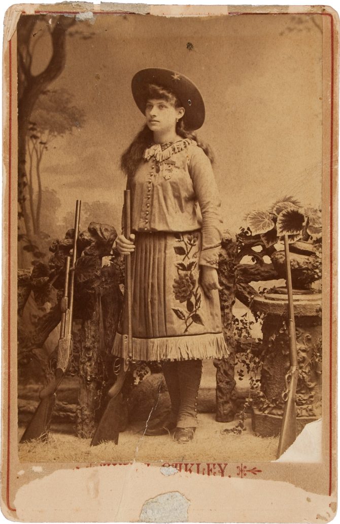 Annie Oakley with three guns, 1887 – costume cocktail